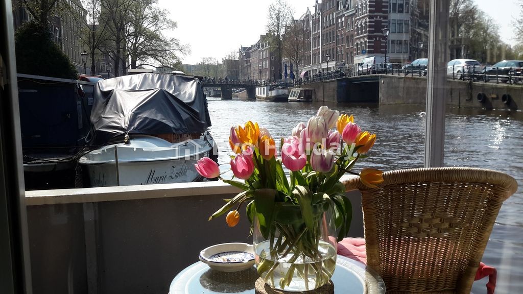 Pantheos Houseboat in Prinsengracht with a view of the Westerkerk the Landmark.